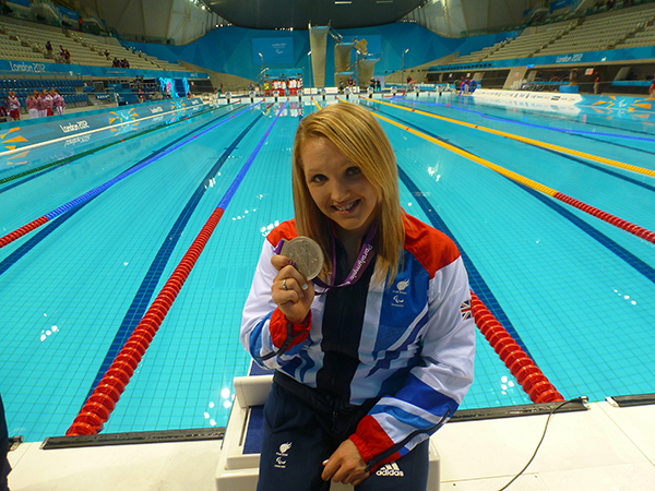 Charlotte Henshaw poolside with medals_600